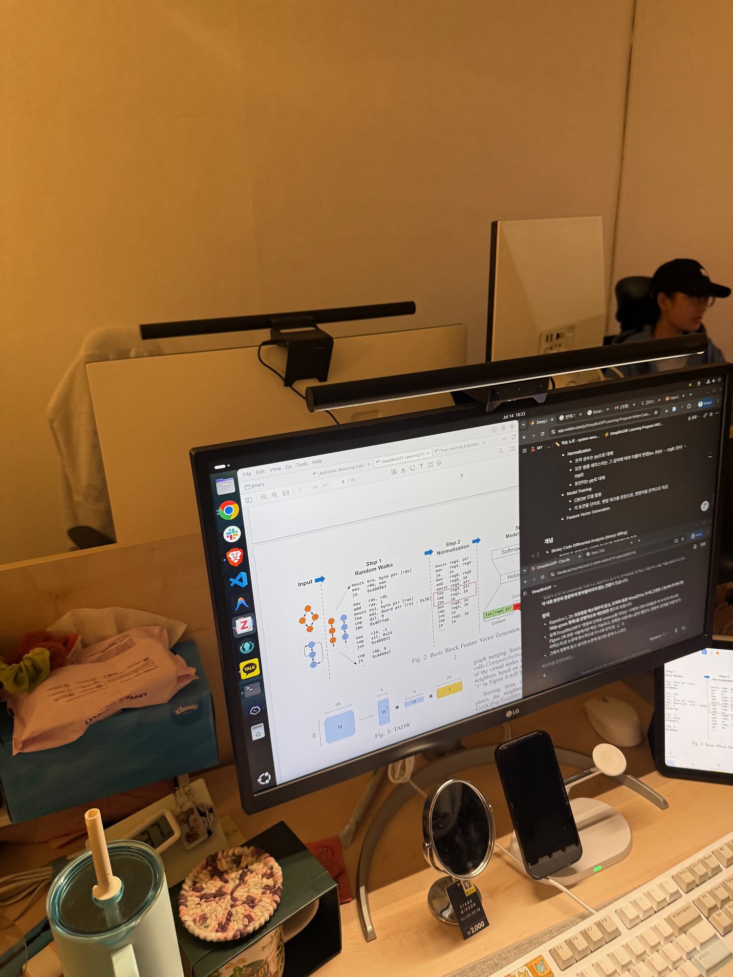 Reading a binary code analysis paper at a lab desk
